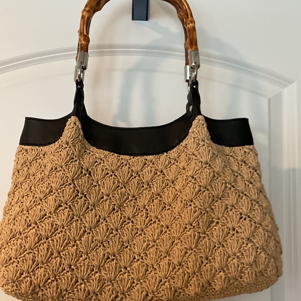 ECHO Crochet hobo bag with black leather trim.
